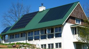 Metal roof with solar panels
