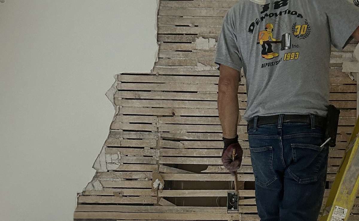 JB Demolition company deconstructing a wall for kitchen renovations