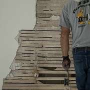 JB Demolition company deconstructing a wall for kitchen renovations