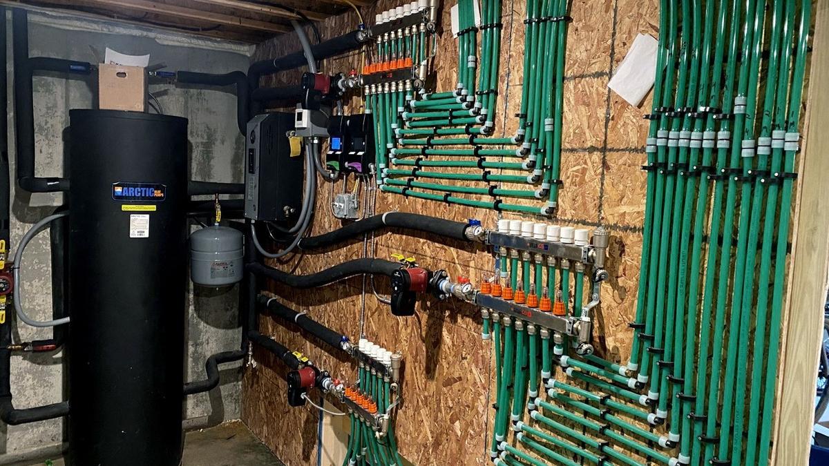 Mechanical room with radiant floor boiler.