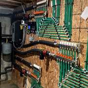 Mechanical room with radiant floor boiler.