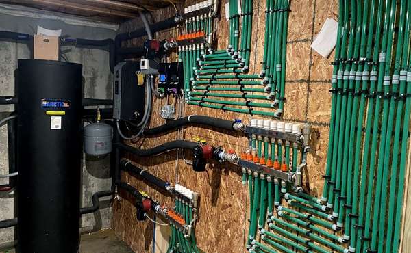 Mechanical room with radiant floor boiler.