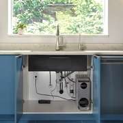 A multi-stage under-counter water filtration system installed neatly inside a ki