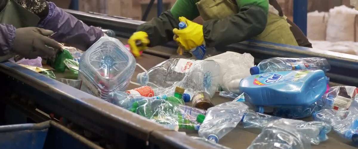 Sorting home recyclable materials at a recycling center