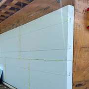 adding seamless rigid foam insulation to the exterior of a home