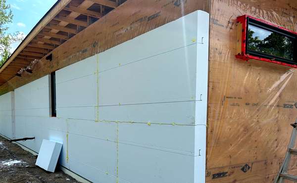 adding seamless rigid foam insulation to the exterior of a home