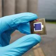 Close up of a highly reflective tandem perovskite solar cell panel.