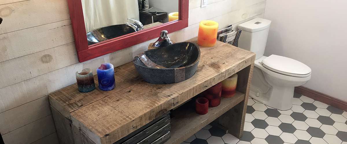 Recycled barn beams and a refinished clawfoot bathtub