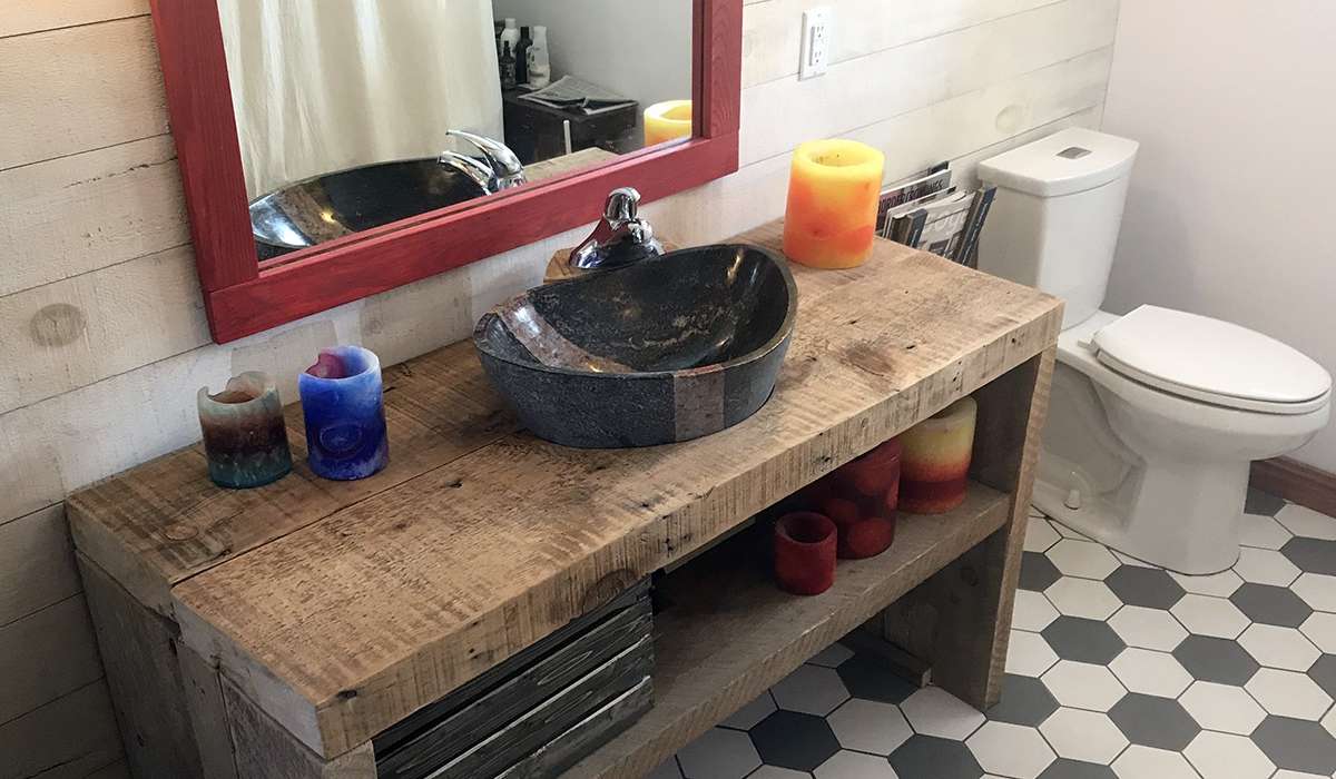 Recycled barn beams and a refinished clawfoot bathtub