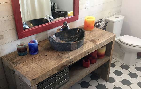 Recycled barn beams and a refinished clawfoot bathtub