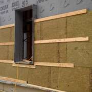 Rigid Rockwool mineral wool insulation boards being installed. Image © Ecohome