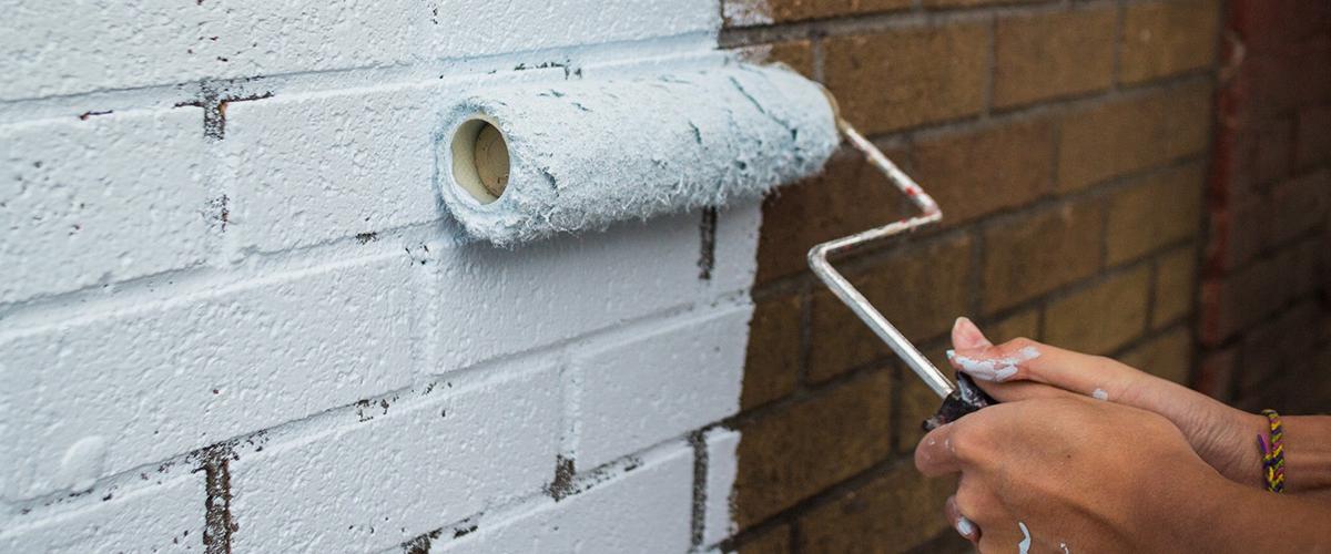 Repainting and refinishing brick facades