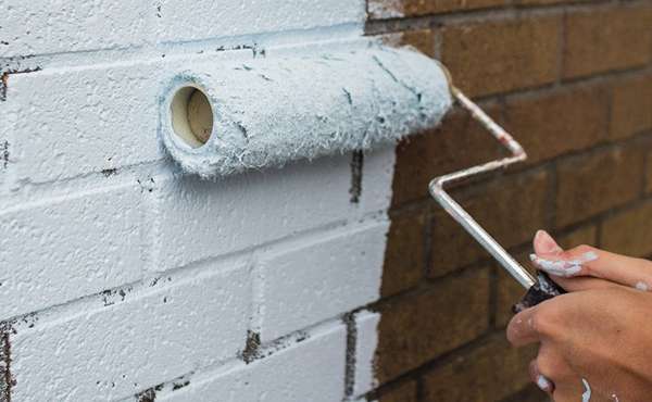 Repainting and refinishing brick facades