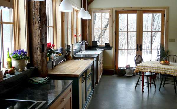 Bathroom with refinished claw foot tub and barn board trim in a home