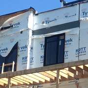 Tyvek home wrap left exposed to wind and UV rays