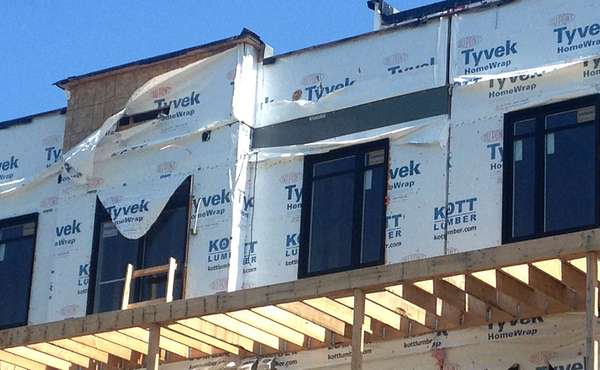 Tyvek home wrap left exposed to wind and UV rays