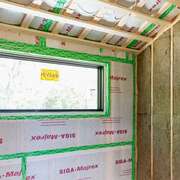 High-Performance Building Tape Applied to a Wall Sheathing