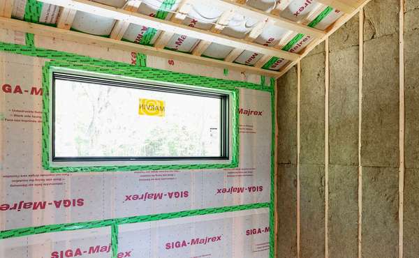 High-Performance Building Tape Applied to a Wall Sheathing