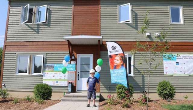 Habitat for Humanity LEED home being delivered to new owners