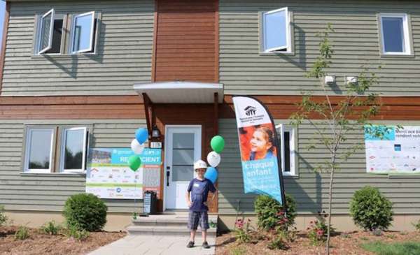 Habitat for Humanity LEED home being delivered to new owners