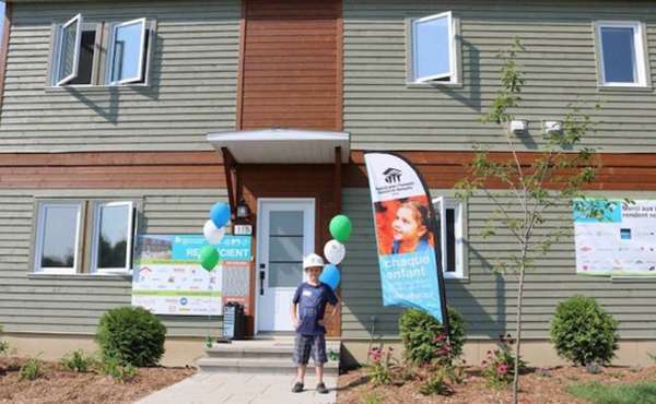 Habitat for Humanity LEED home being delivered to new owners
