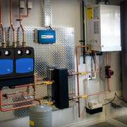 Mechanical room with radiant floor boiler.