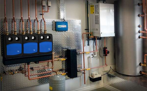 Mechanical room with radiant floor boiler.