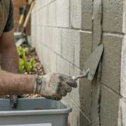 A close up of a concrete crack being repaired with self healing concrete