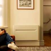 The Merino Mono indoor heat pump mounted on an exterior wall in a modern living
