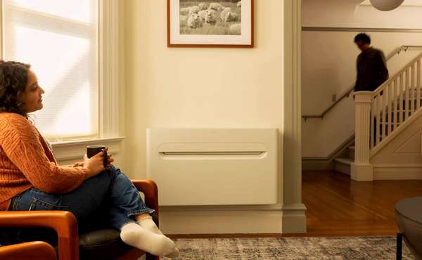 The Merino Mono indoor heat pump mounted on an exterior wall in a modern living