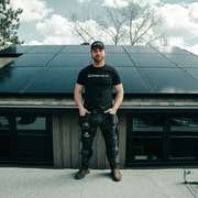 Residential roof in Calgary with an extensive grid-tied solar panel array