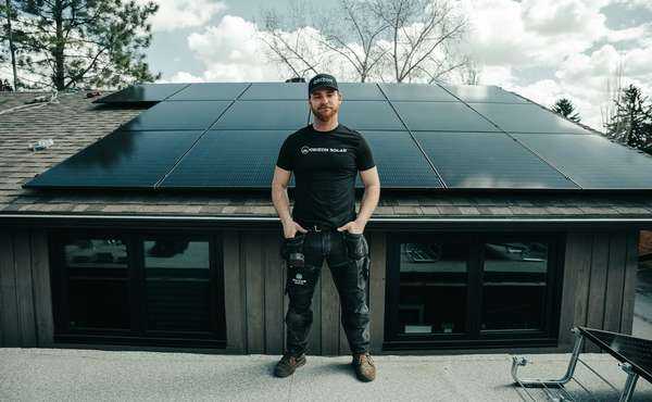 Residential roof in Calgary with an extensive grid-tied solar panel array