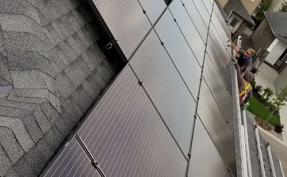 Solar Panels on suburban home with full array of solar panels installed on roof