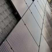 Solar Panels on suburban home with full array of solar panels installed on roof