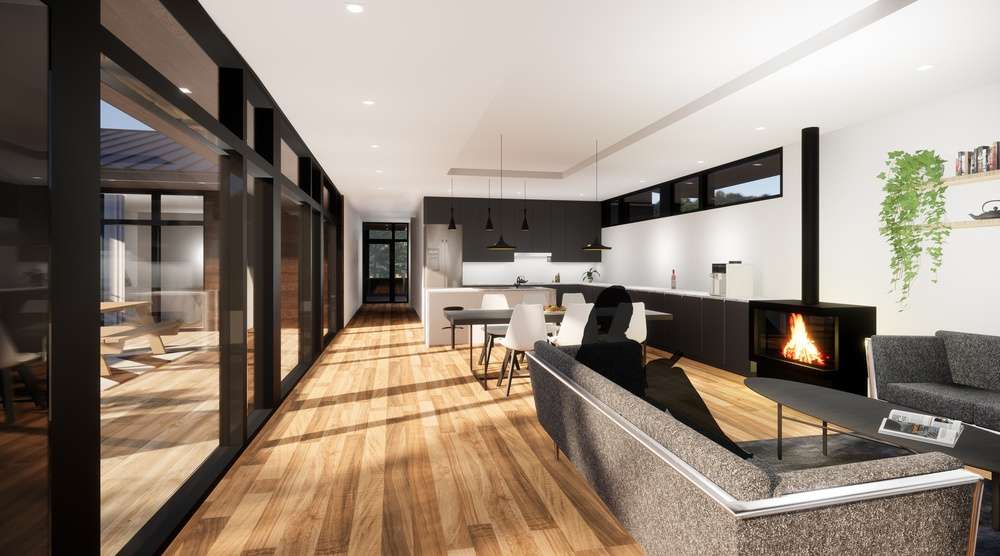 This high performance prefab green home has a triple glazed window along 36' of wall.