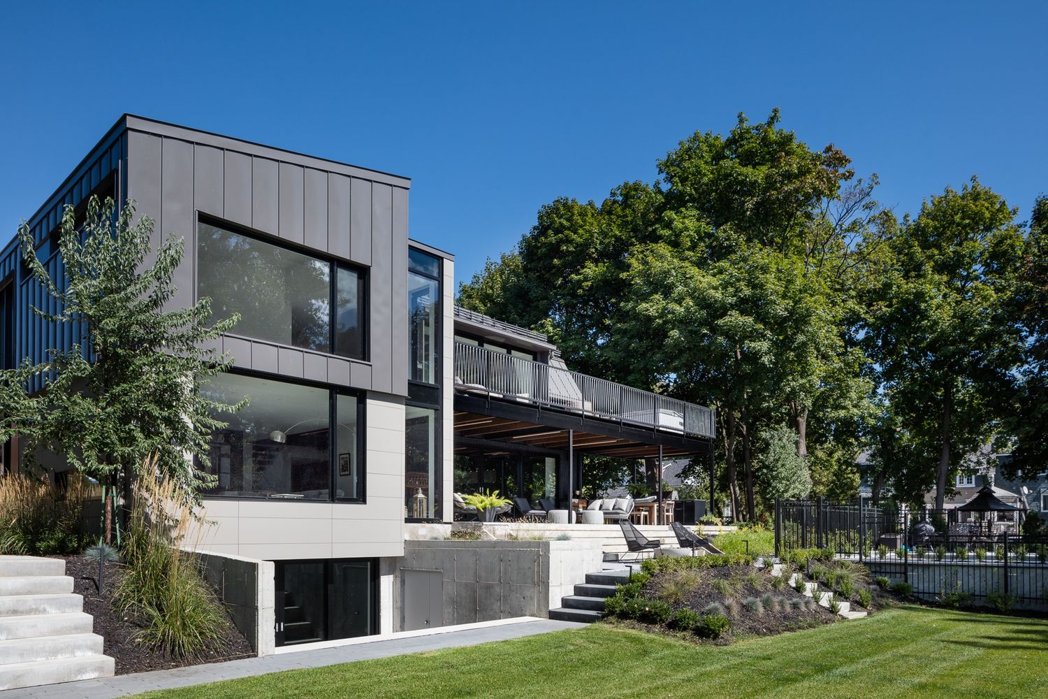 Backyard from a Home extensions project near Montreal (Greater Montreal) by GHOCHE ARCHITECTE