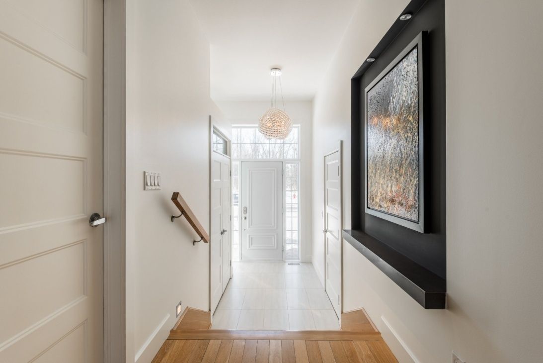 Vestíbulo de entrada de un proyecto de tipo Viviendas unifamiliares cerca de Montreal (Gran Montreal) por D.SAINT design