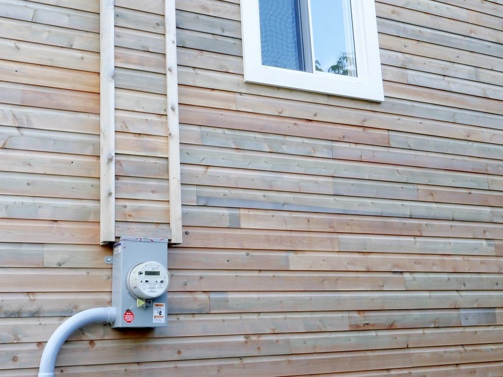 Exterior Finishes from a Single family homes project near Rimouski (Bas-Saint-Laurent) by La Couverte Construction Communautaire