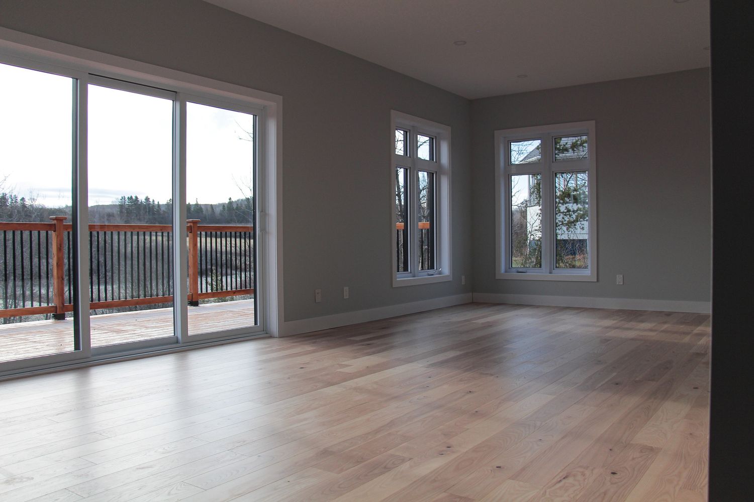 Salon d'un projet de Maisons unifamiliales près de Rimouski (Bas-Saint-Laurent) de Construction Norac