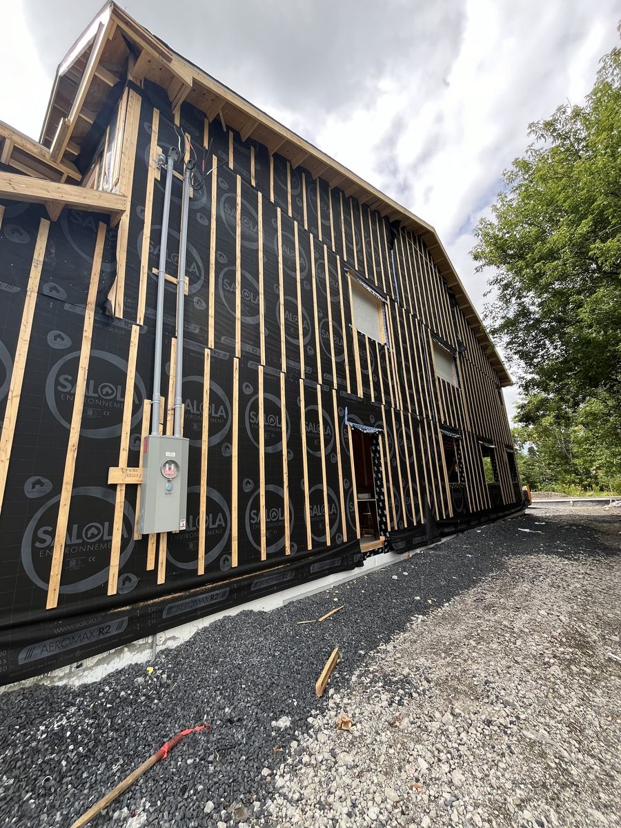 Construcción de exteriores de casas de un proyecto de tipo Sellado hermético cerca de Montreal (Gran Montreal) por Isolution Éco Construction