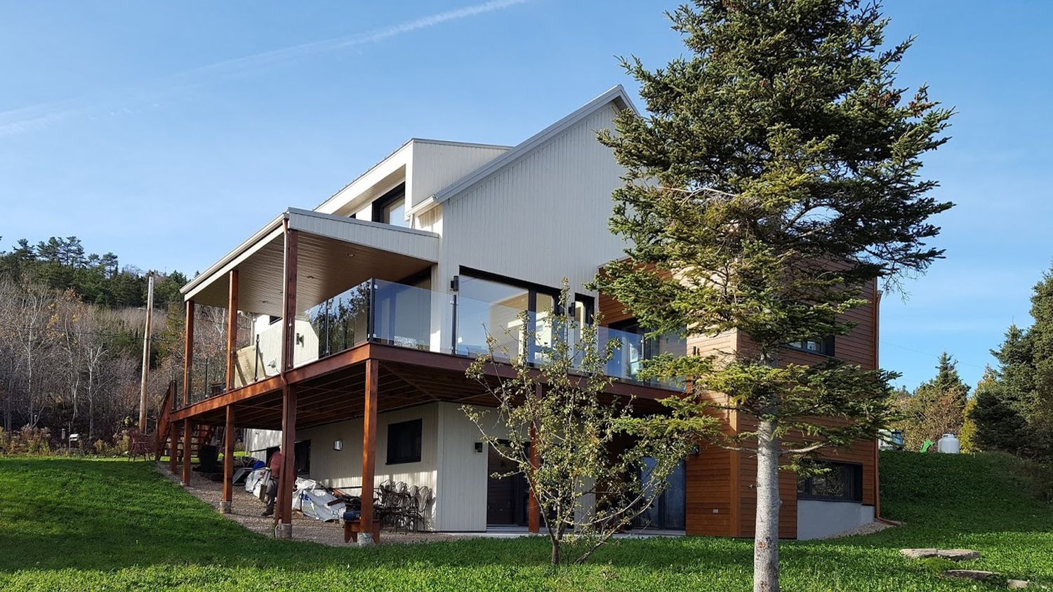 Backyard from a Single family homes project near Quebec City - Levis by TERGOS Architecture + Construction