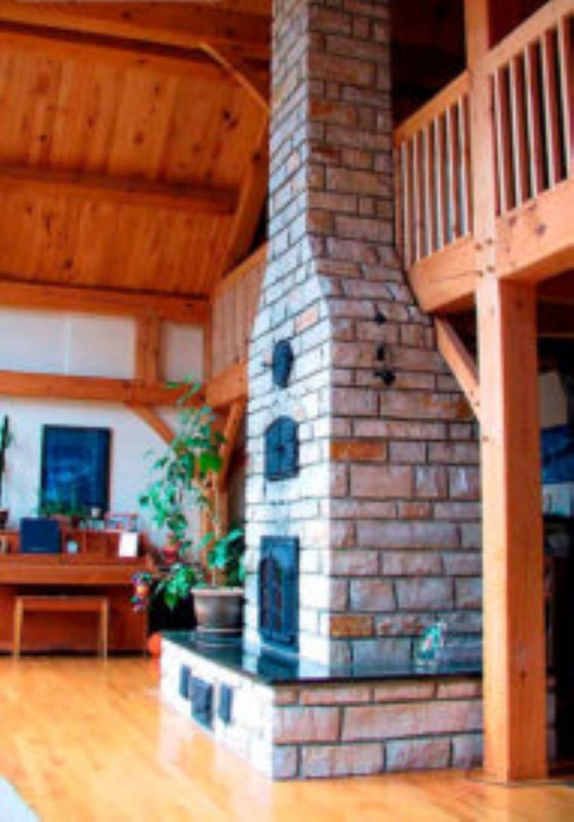 Living Room from a Masonry Heaters & Thermal Mass Stoves project near Quebec City - Levis by Foyers Radiants Debriel
