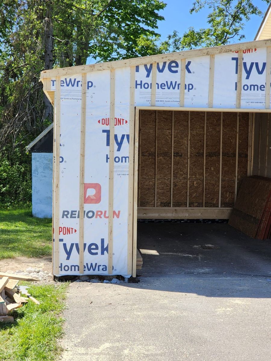 Construcción de exteriores de casas de un proyecto de tipo Garajes cerca de Montreal (Gran Montreal) por J E Construction