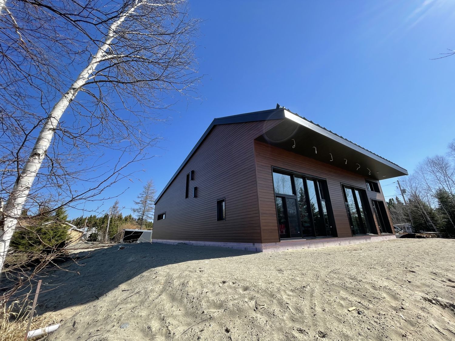 Construcción de exteriores de casas de un proyecto de tipo Viviendas unifamiliares cerca de Abitibi-Témiscamingue por Constructions Rivard Inc.