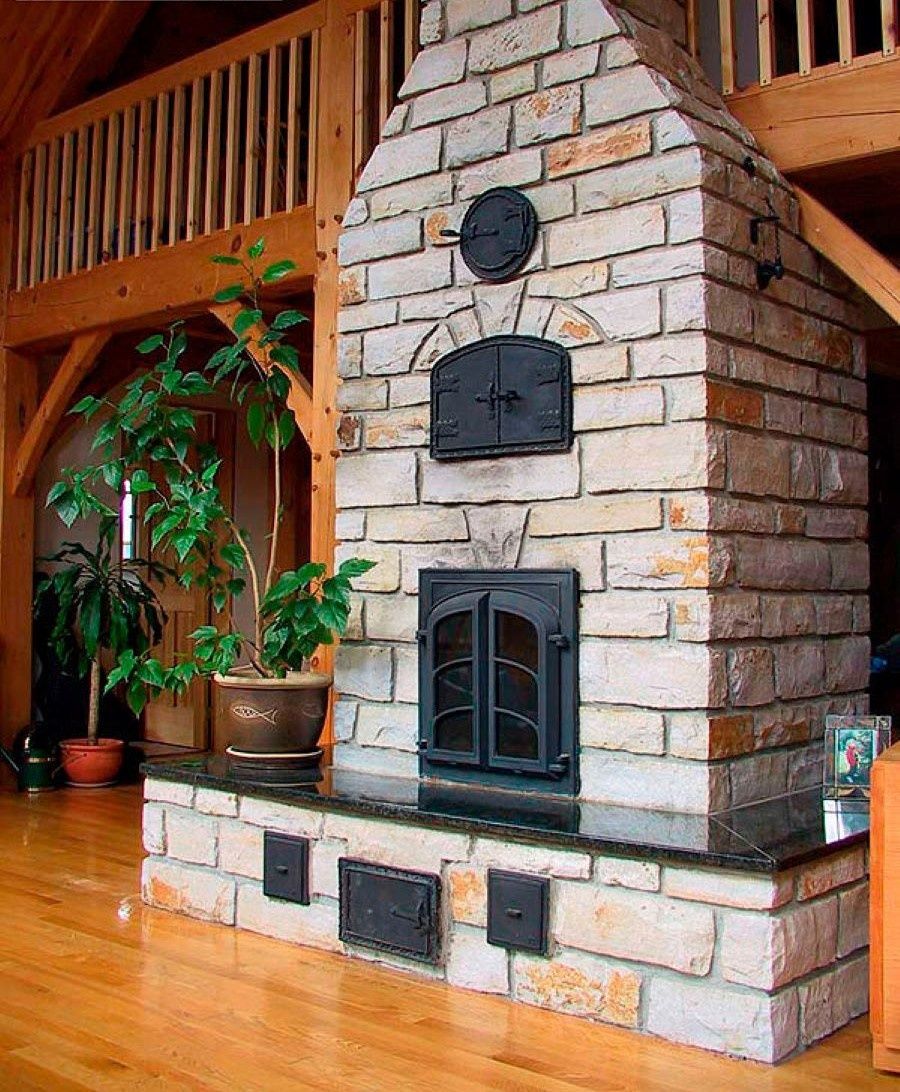 Living Room from a Masonry Heaters & Thermal Mass Stoves project near Quebec City - Levis by Foyers Radiants Debriel