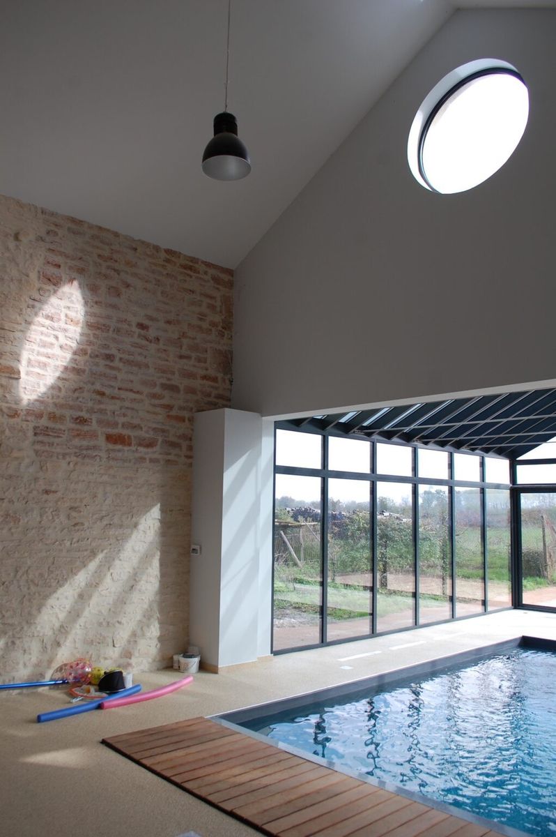 Pool & Natural Pond from a Single family homes project near Saône-et-Loire (71) by Naos Atelier d’Architecture