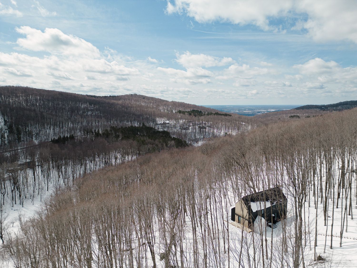 Vista aérea de un proyecto de tipo Viviendas unifamiliares cerca de Granby - Bromont - Cowansville por Stroph Architecture & Design