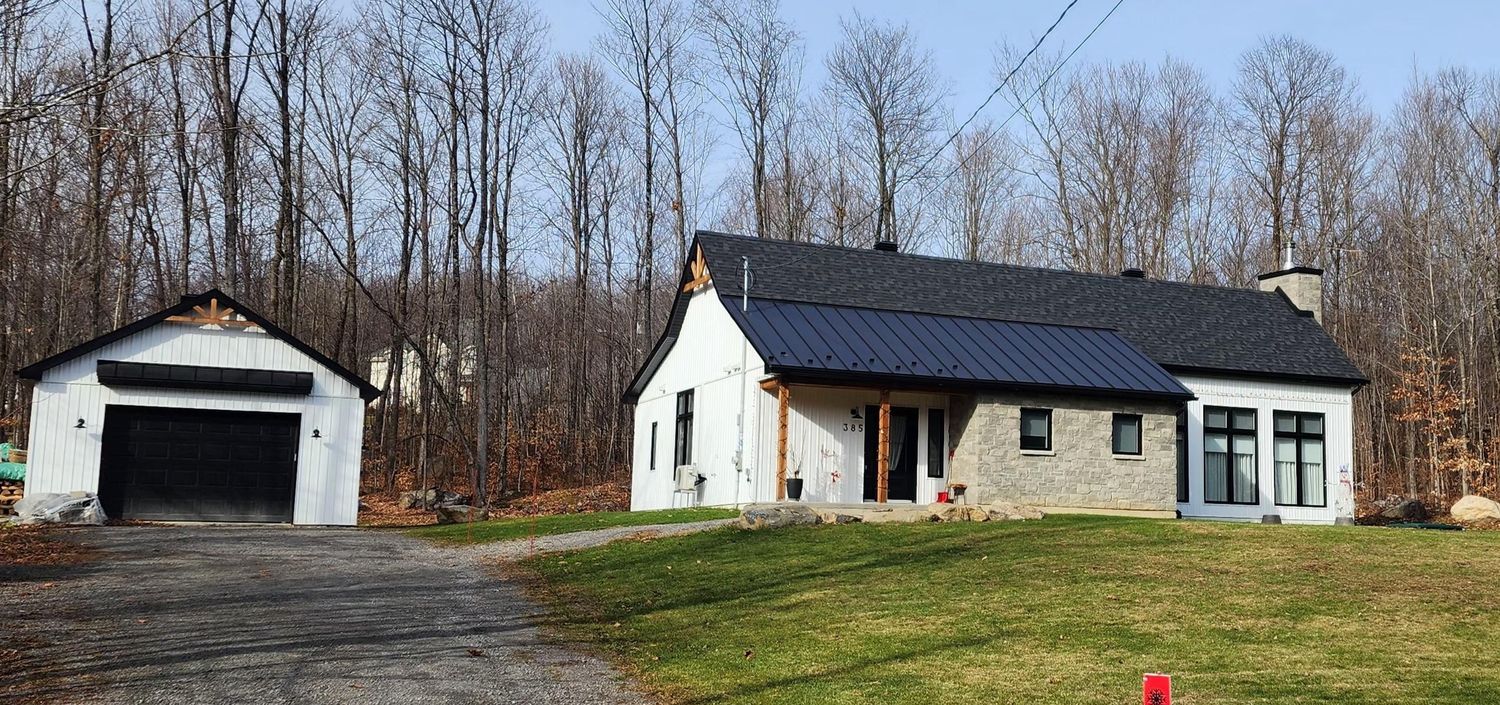 House Exterior from a Single family homes project near Saint-Jerome (Laurentides) by Les Plans Benoit Nadon