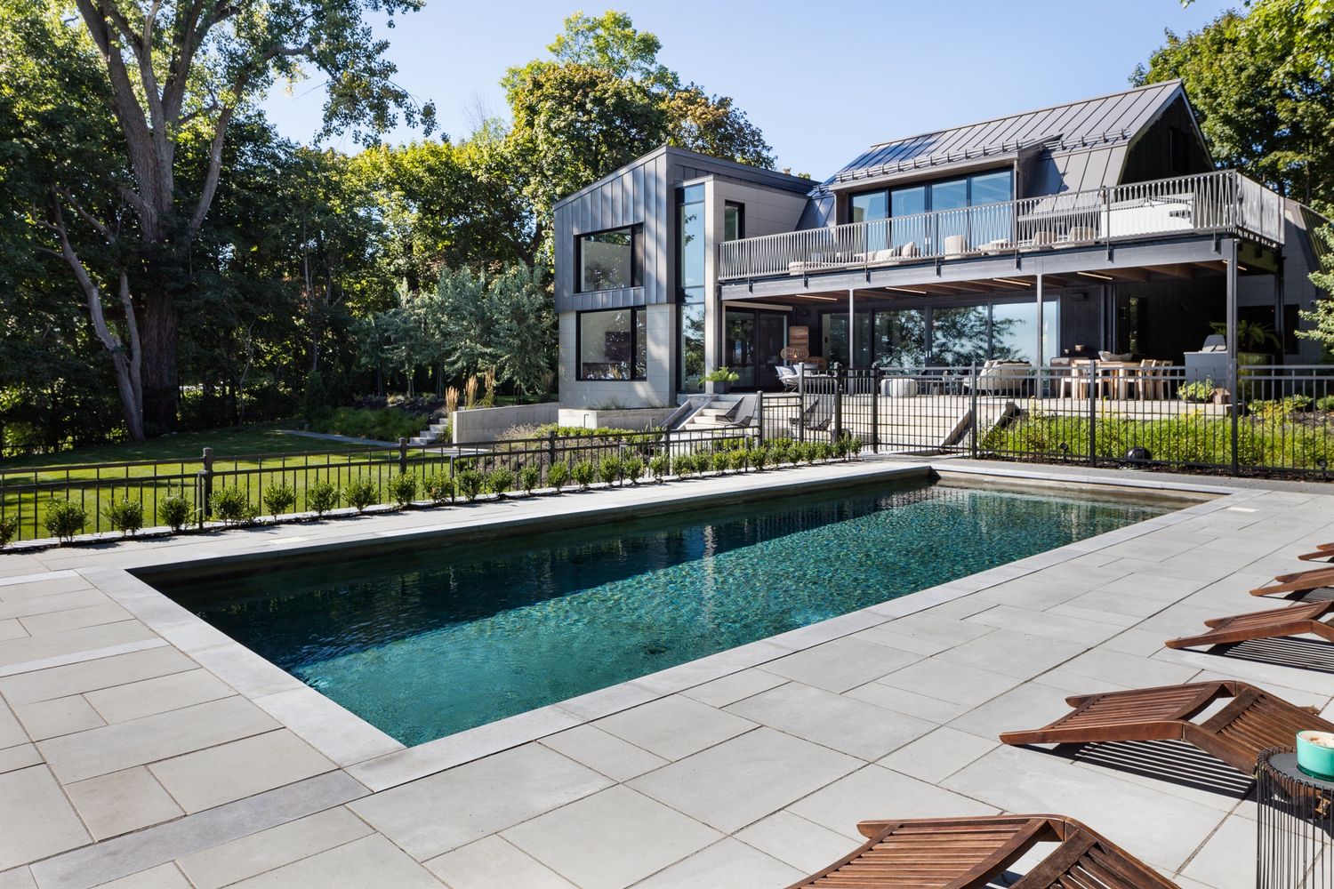 Pool & Natural Pond from a Home extensions project near Montreal (Greater Montreal) by GHOCHE ARCHITECTE