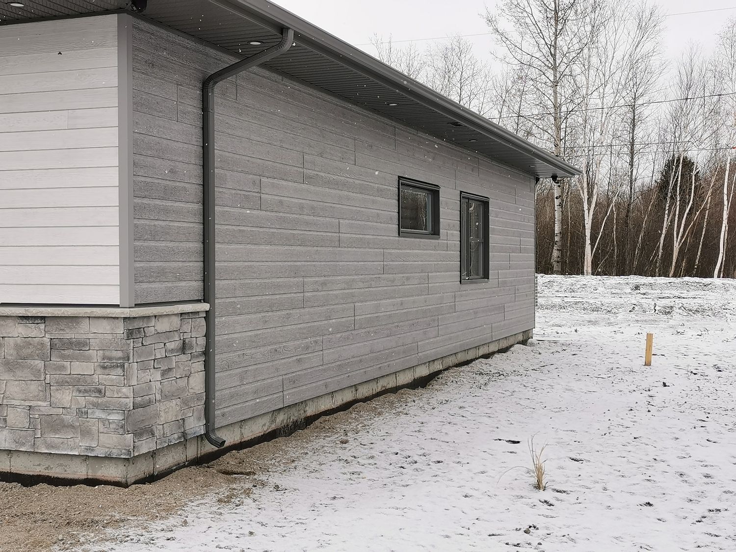 Acabado exterior de un proyecto de tipo Viviendas unifamiliares cerca de Saguenay - Lac-Saint-Jean por Solutions Expert SSS